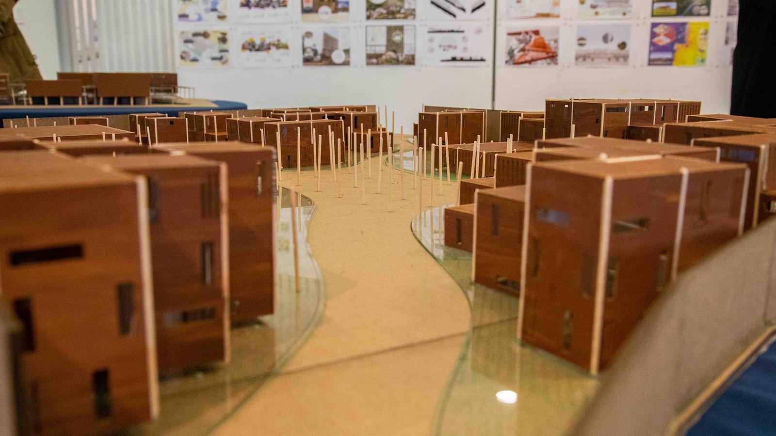 architectural models on a table in a classroom